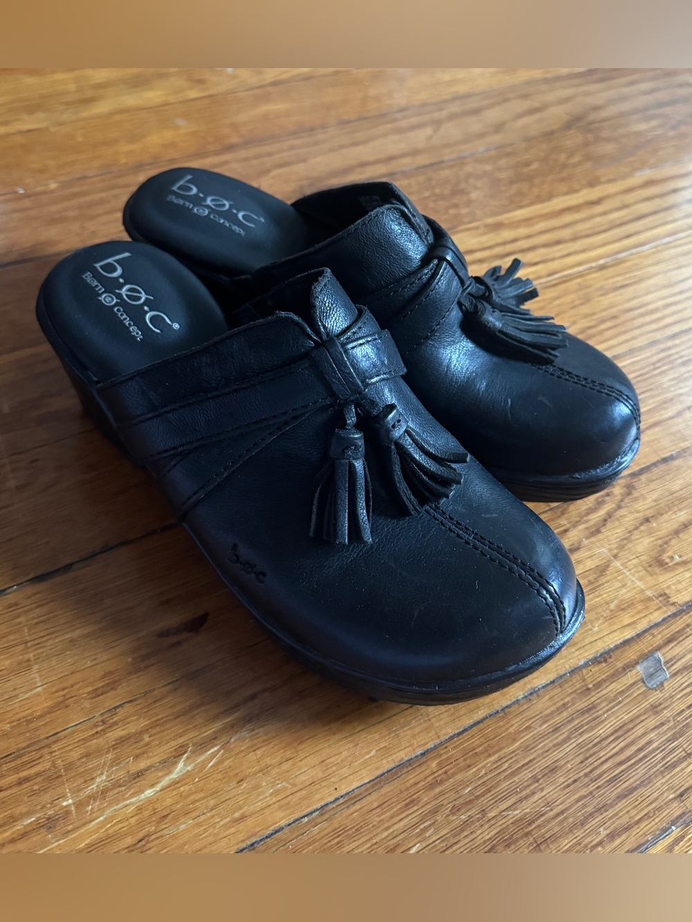 b.ø.c Black Leather Tassel Clogs